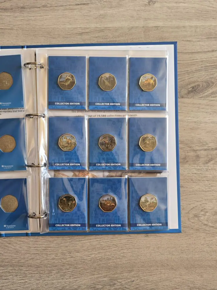 Collection of 31 Dinosaur 50p Shaped Commemoratives in album with COA